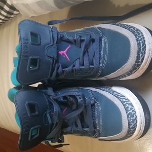 Jordan pink and blue sneakers.